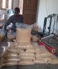 Jaggery powder being packed for sale.jpg